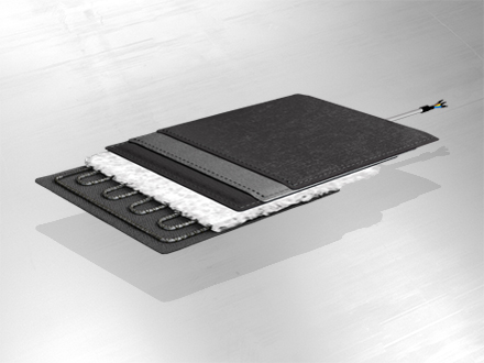 Layer structure of a trace heating system on gray background